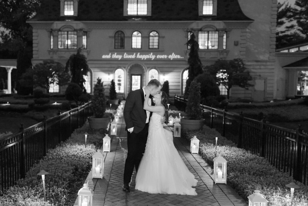 Black and white of bride and groom outside The Ashford Estate