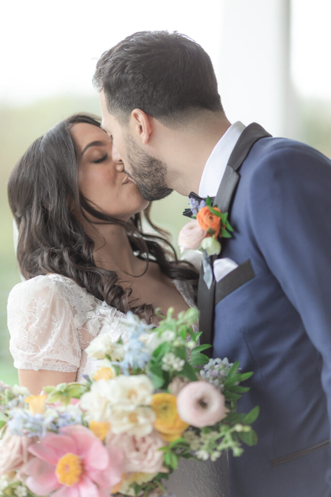 Bride and groom outdoor kiss at Bear Brook Valley