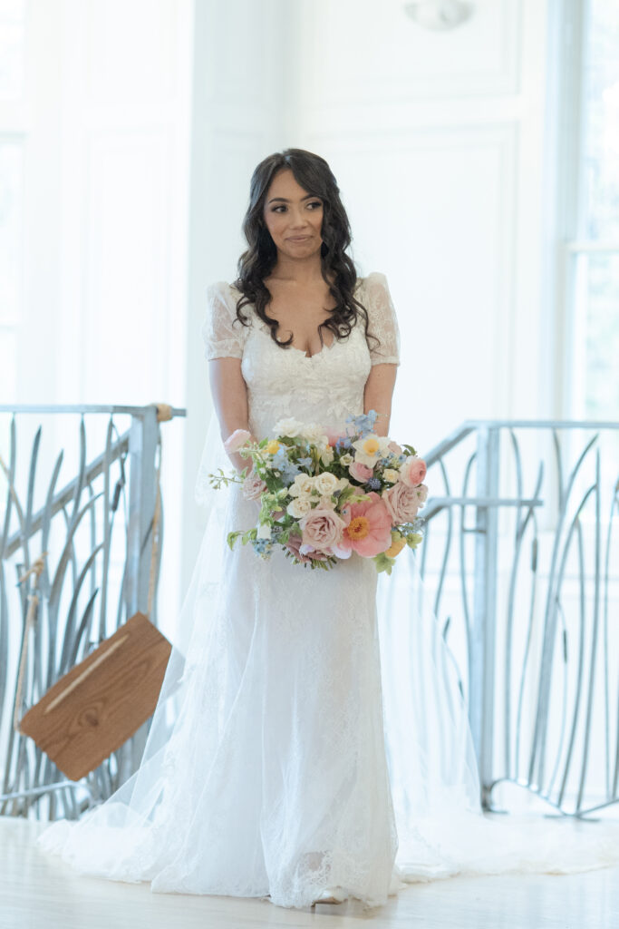 Bride walking down aisle for indoor ceremony