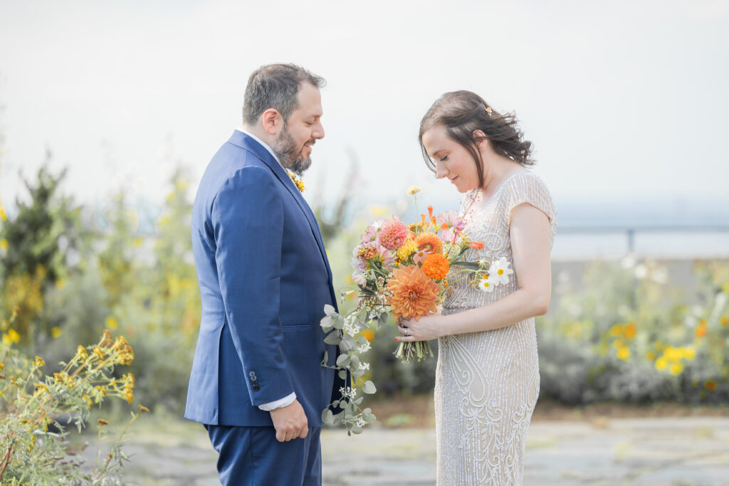 First look moment between bride and groom at Brooklyn rooftop venue