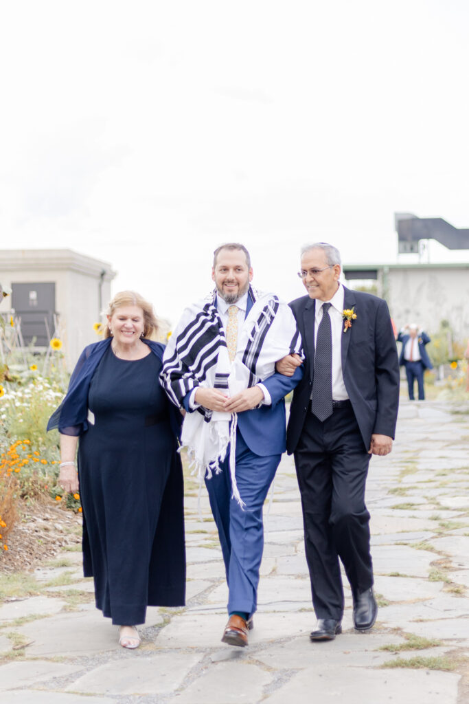 Groom walking in wedding ceremony on Brooklyn Grange Rooftop