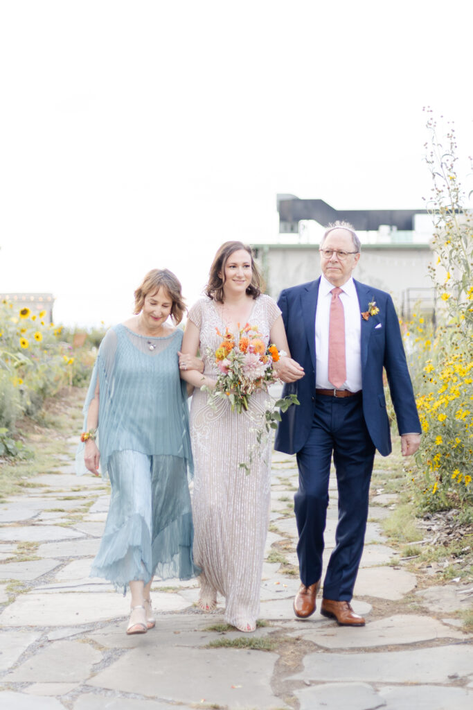 Bride walking in wedding ceremony on Brooklyn Grange Rooftop