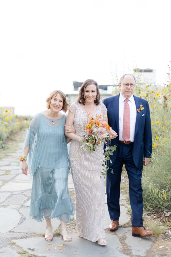 Bride walking in wedding ceremony on Brooklyn Grange Rooftop