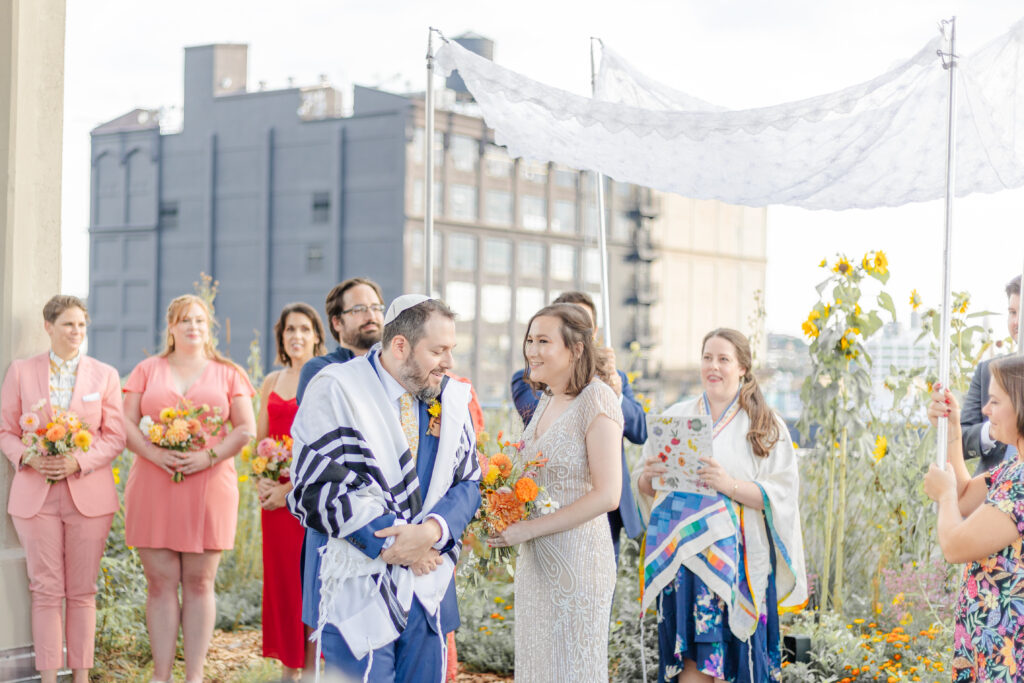 Jewish wedding ceremony at venue rooftop