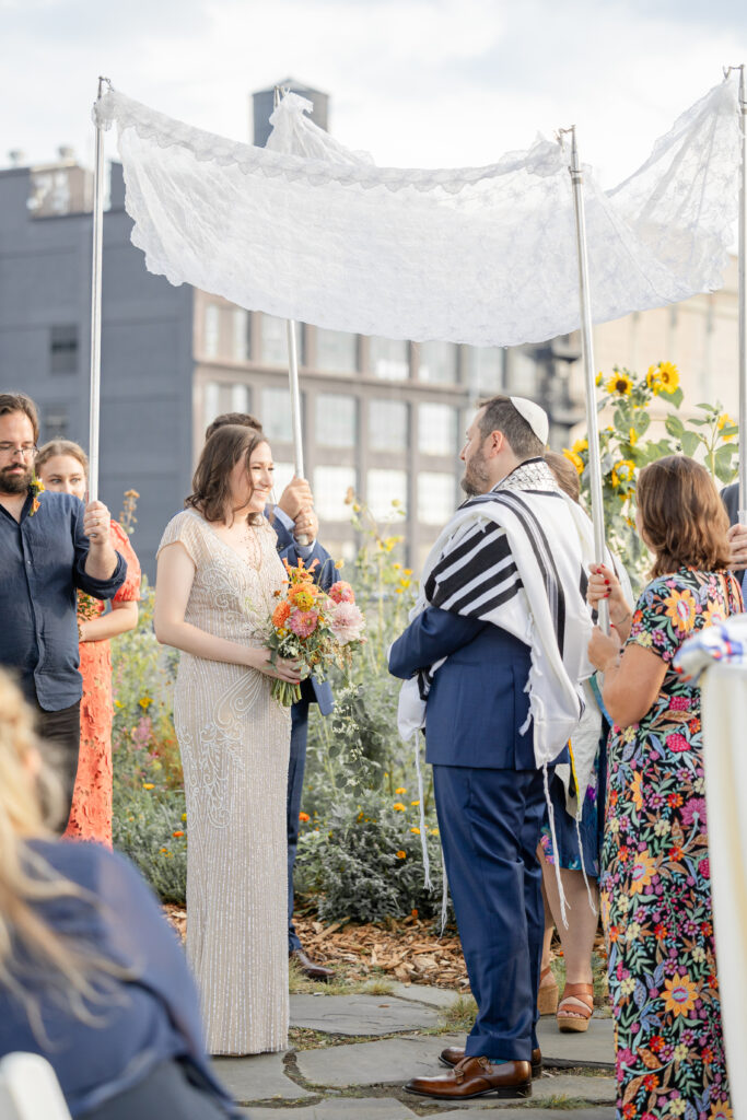 Jewish wedding ceremony at venue rooftop