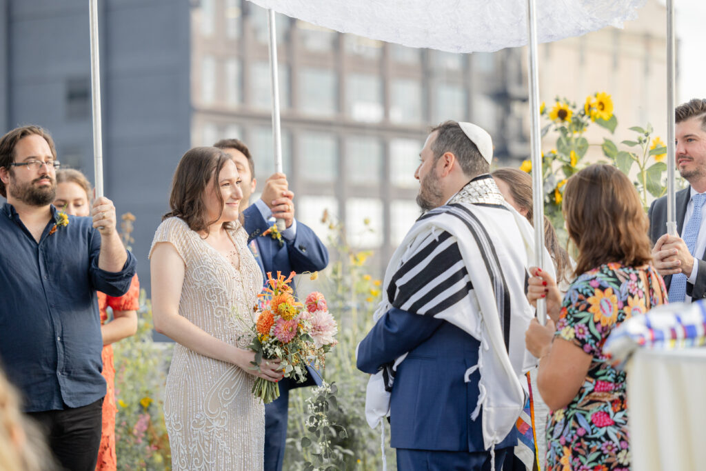 Jewish wedding ceremony at venue rooftop