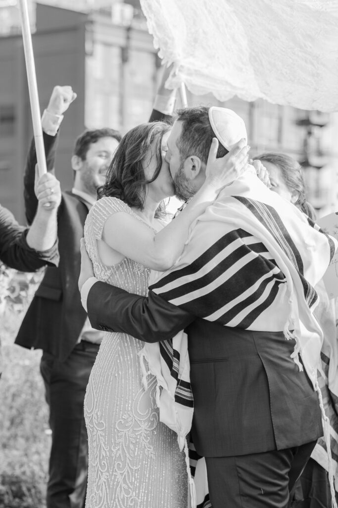 Kiss at aisle for Jewish wedding