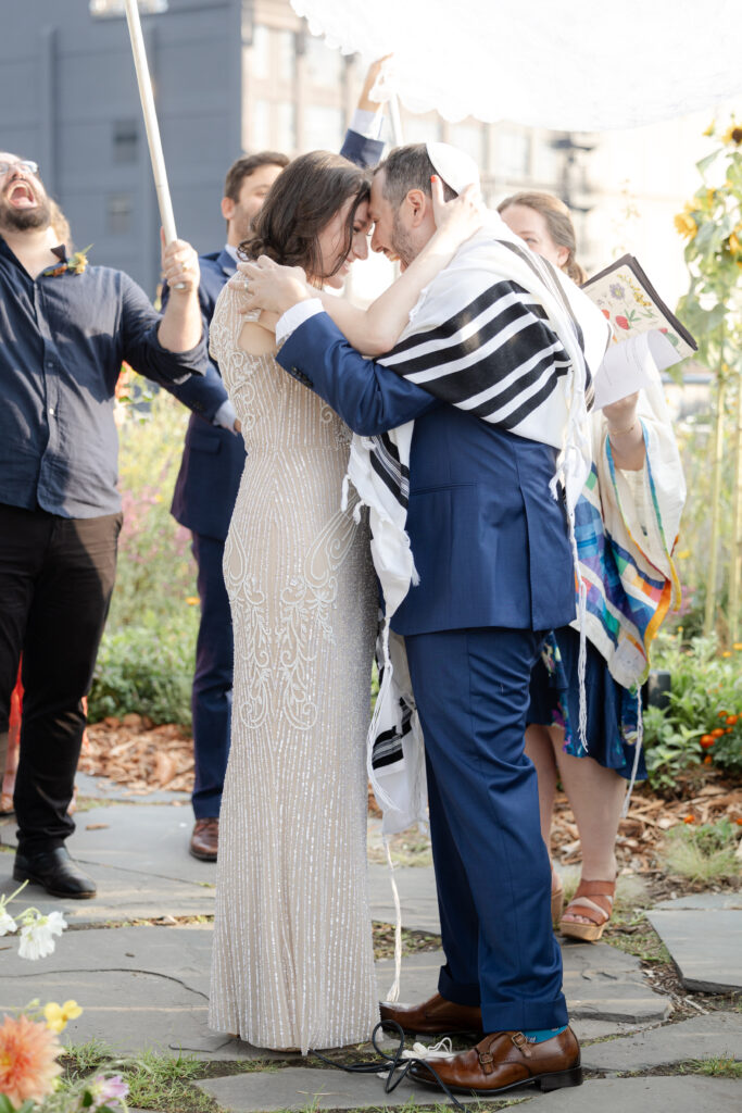 Kiss at aisle for Jewish wedding