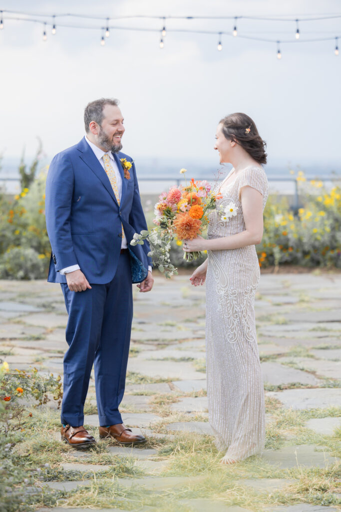 First look moment between bride and groom at Brooklyn rooftop venue