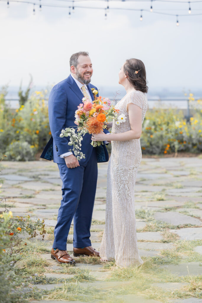 First look moment between bride and groom at Brooklyn rooftop venue