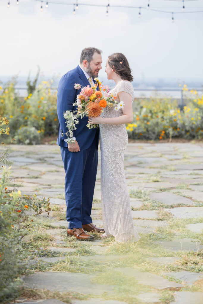 First look moment between bride and groom at Brooklyn rooftop venue