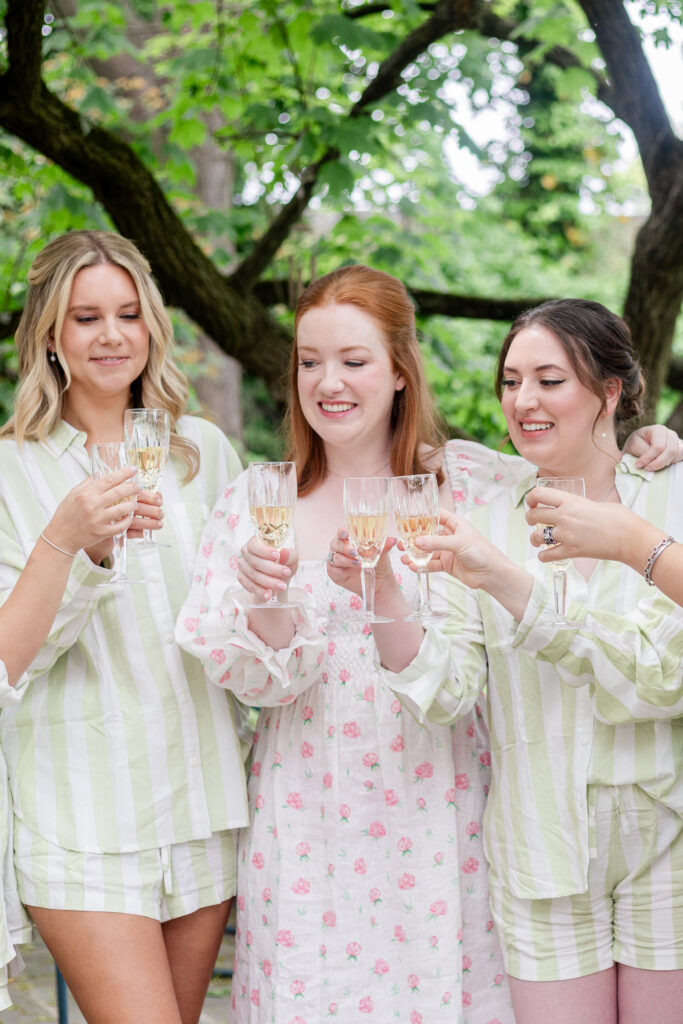 Bride and bridesmaid champaign cheer