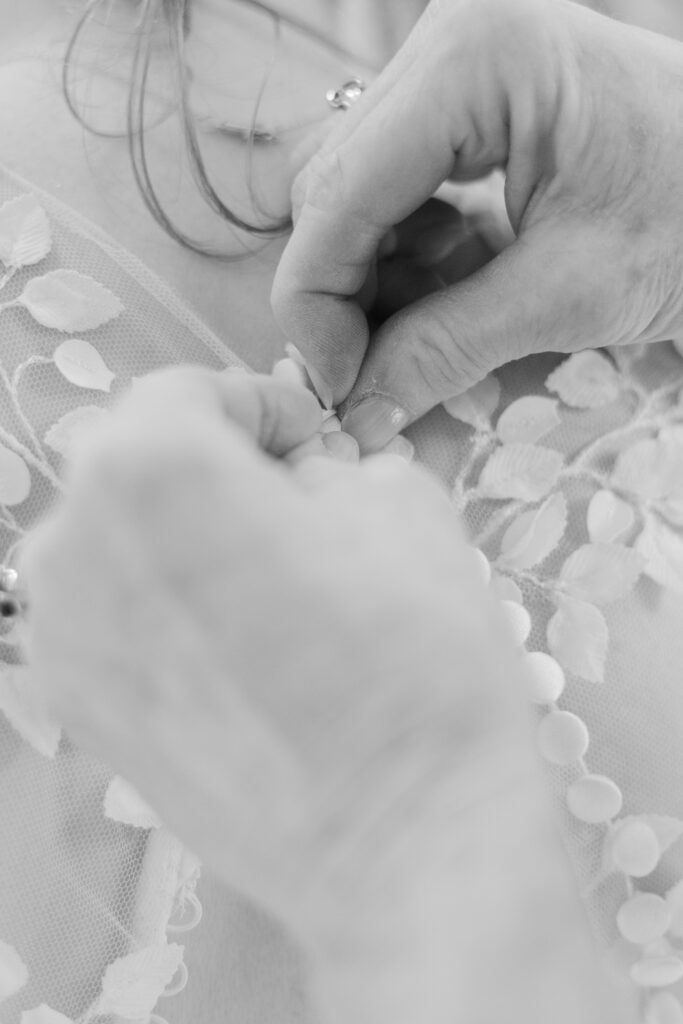 Black and white of buttoning bridal sleeve