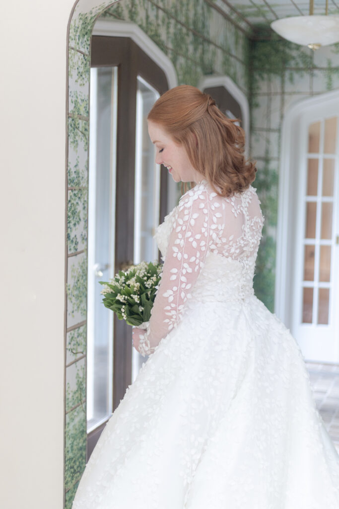 Bride looking at her bouquet