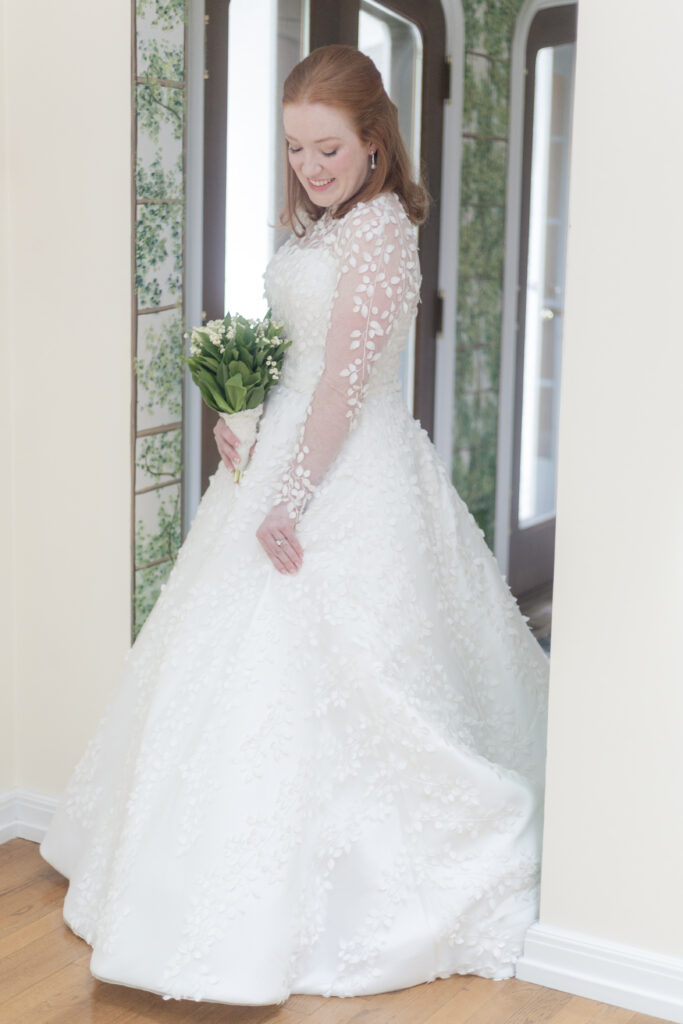 Bride playing with her elegant wedding dress