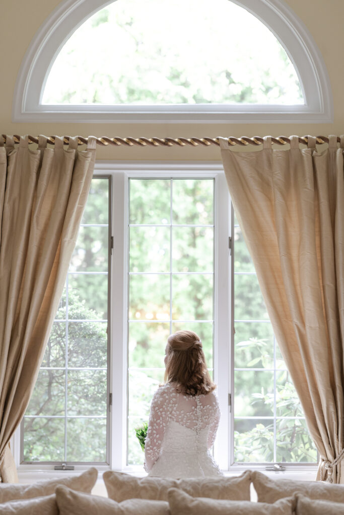 Bride looking out the window