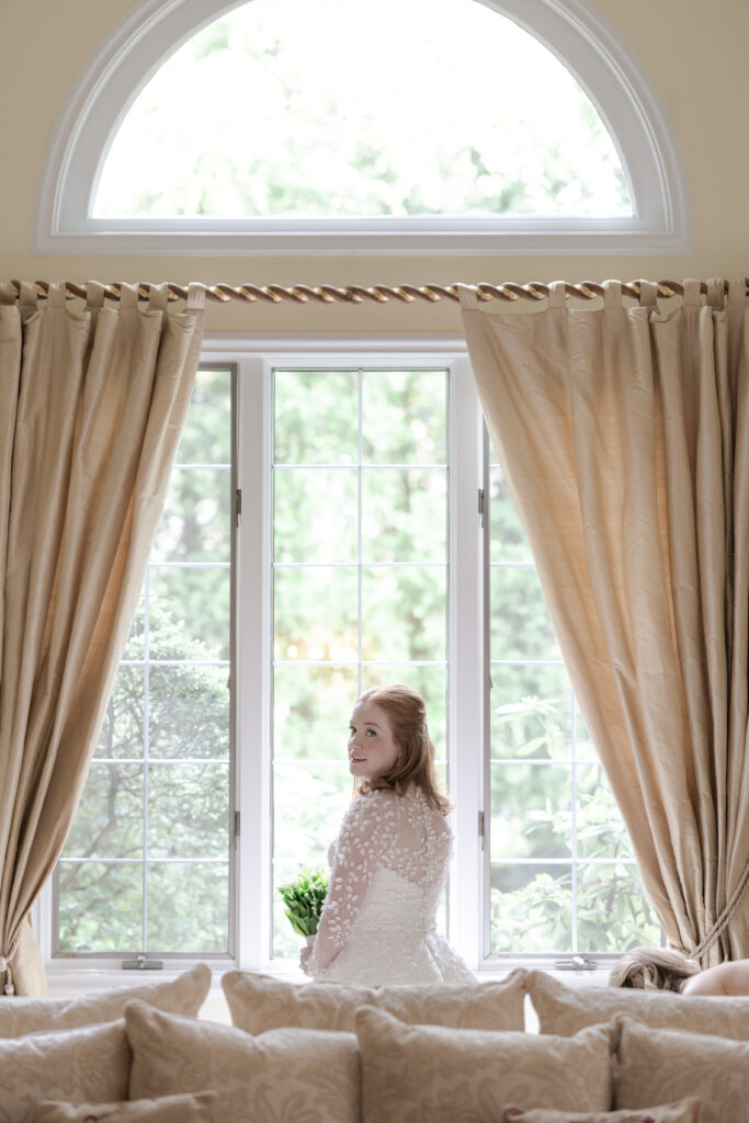 Bride in front of window