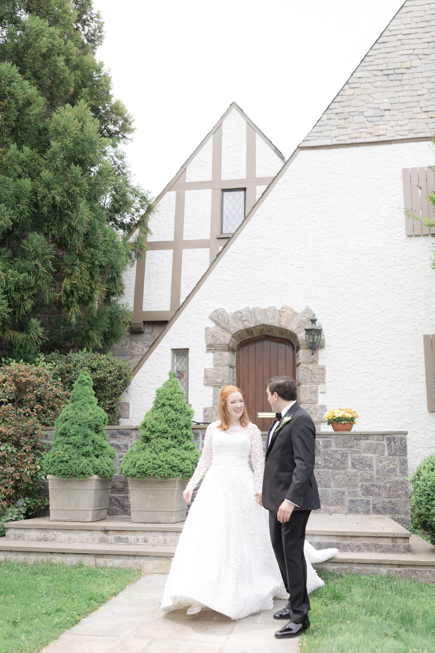 Bride and groom in front of Larchmont house