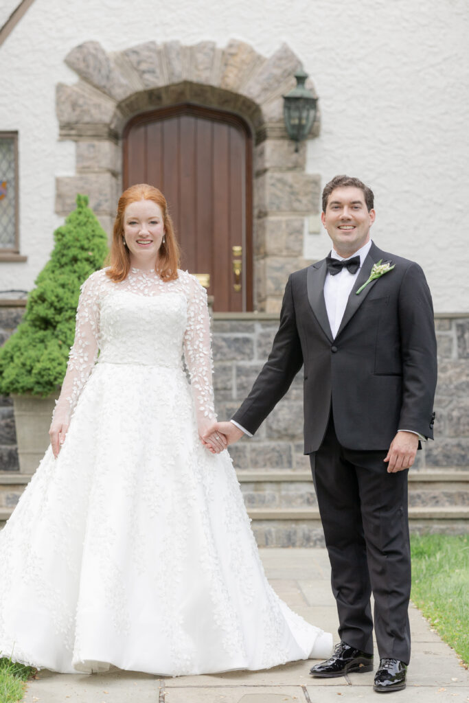 Bride and groom in front of Larchmont house