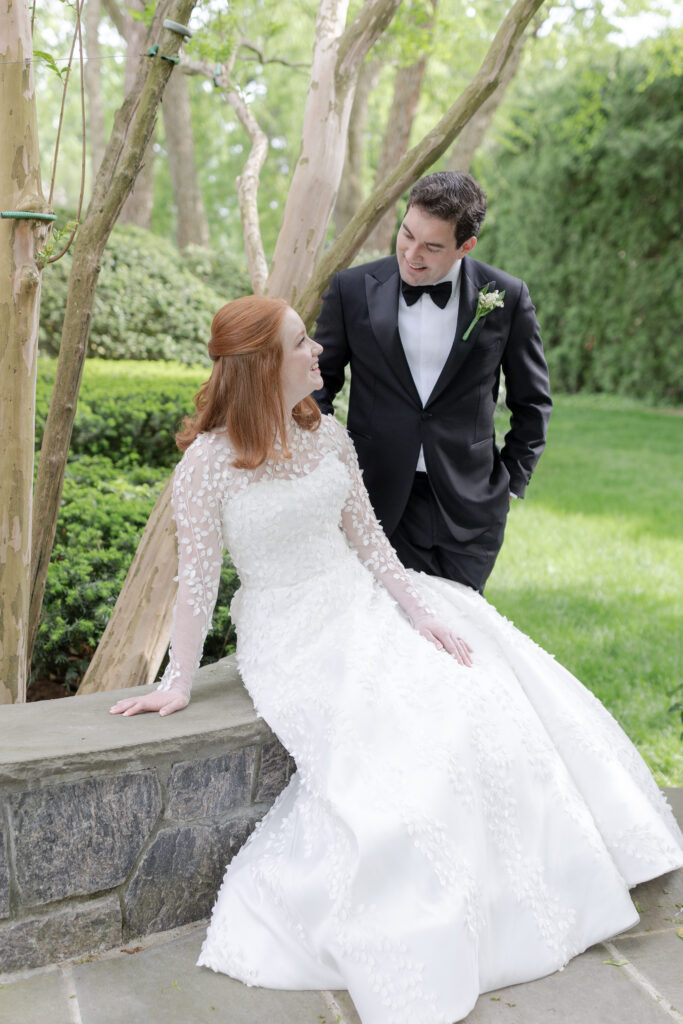 Bride and groom with greenery background