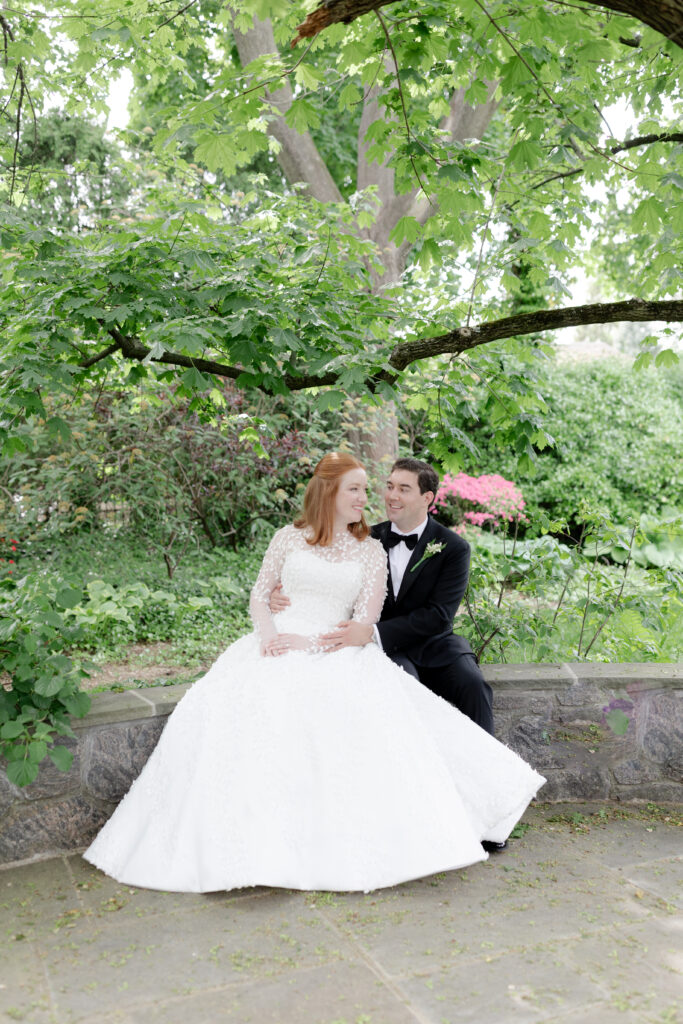 Bride and groom with greenery background