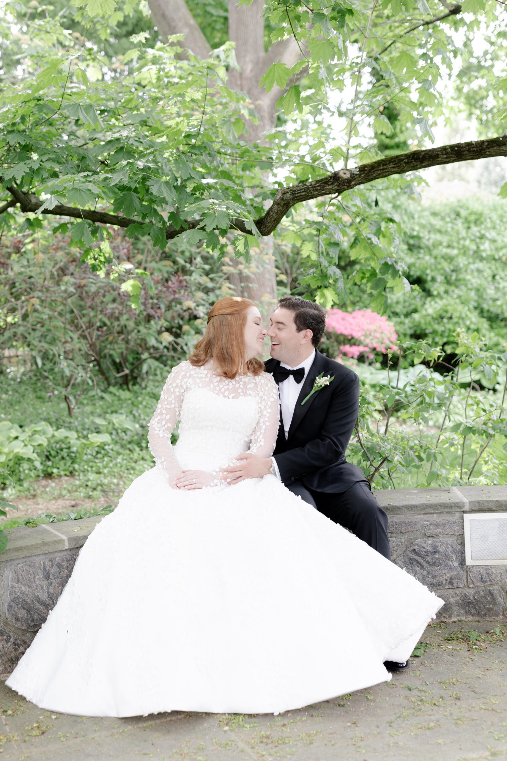 Bride and groom with greenery background