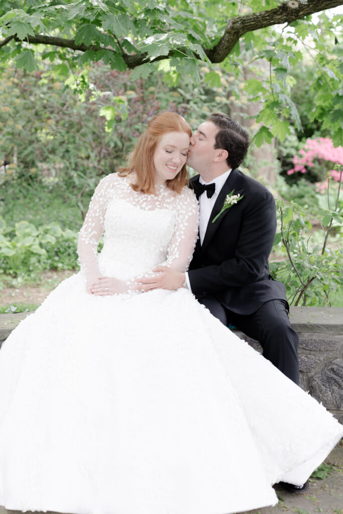 Bride and groom with greenery background