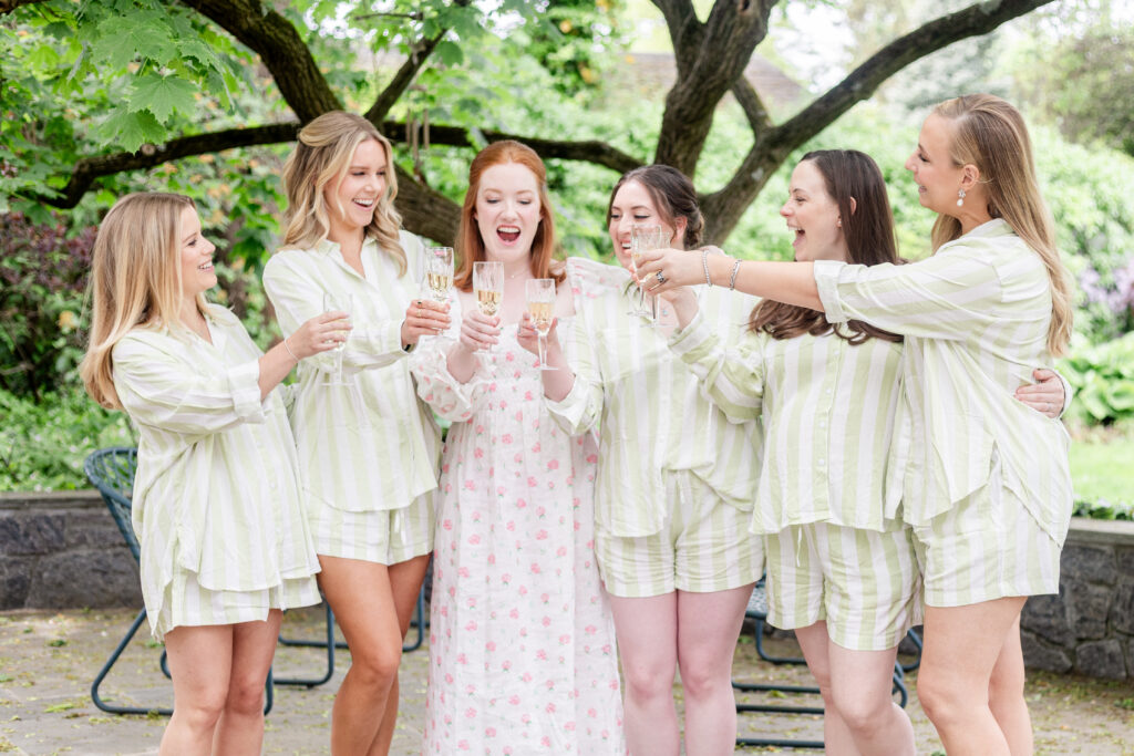 Bride and bridesmaid cheering with champaign