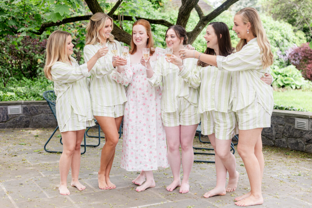 Bride and bridesmaid cheering with champaign