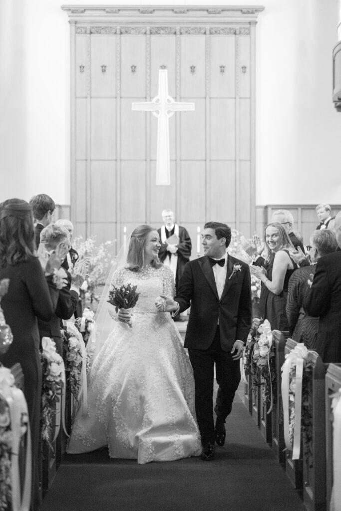 Bride and groom walking down the aisle