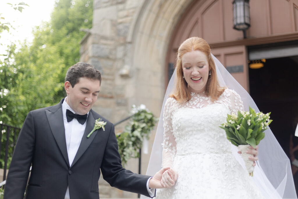 Bride and groom outside Larchmont Church after wedding ceremony