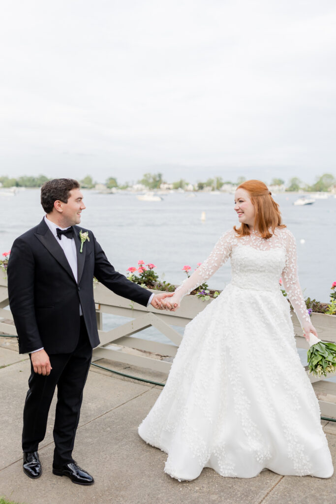 Bride and groom in front of Larchmont Yacht Club wedding venue