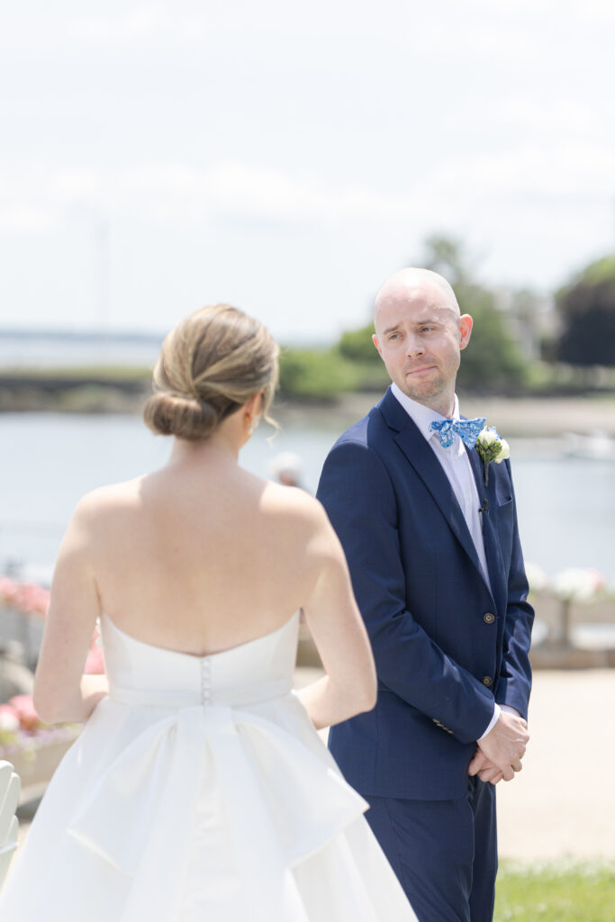 Bride and groom first look outside of yacht club wedding venue