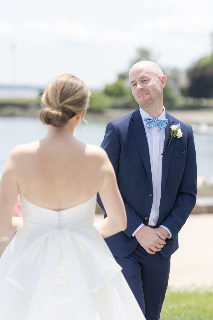 Bride and groom first look outside of yacht club wedding venue