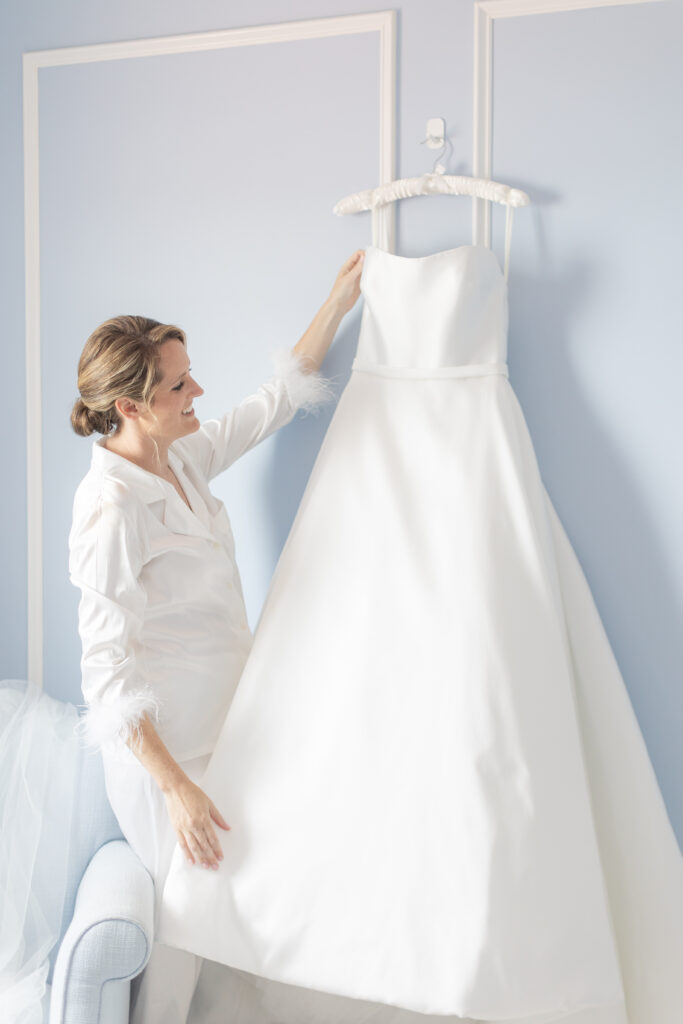 Bride and bride's wedding dress at yacht club wedding venue bridal suite