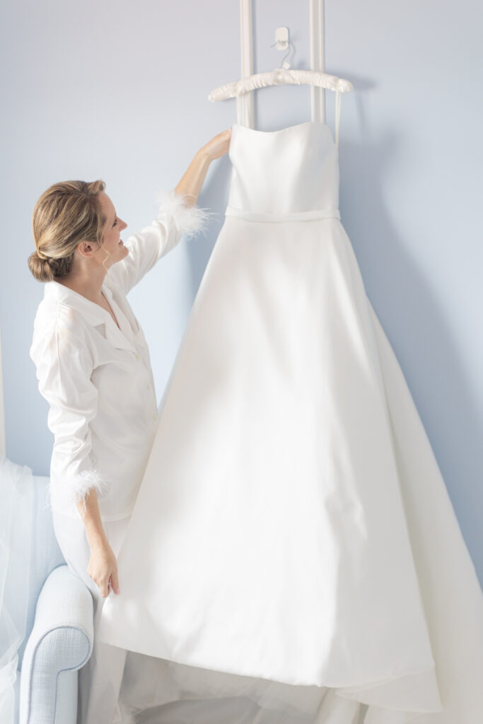 Bride and bride's wedding dress at yacht club wedding venue bridal suite