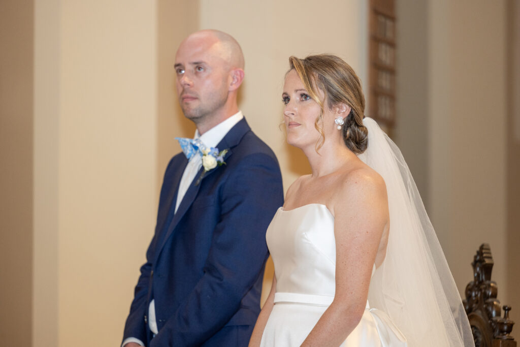 Bride and groom wedding ceremony inside church ceremony