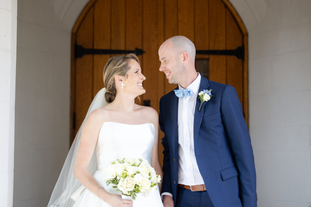 Bride and groom outside of wedding church