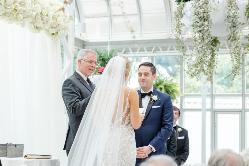 Bride reading vows at wedding ceremony inside NJ Wedding venue