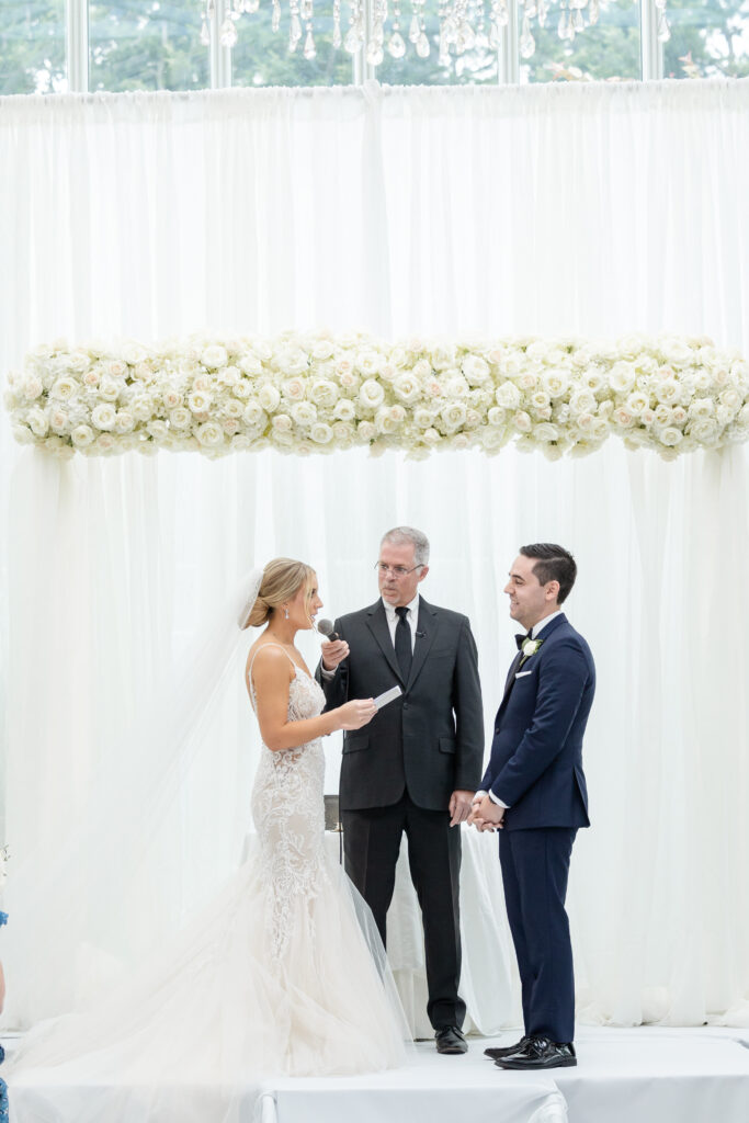 Bride reading vows at wedding ceremony inside NJ Wedding venue