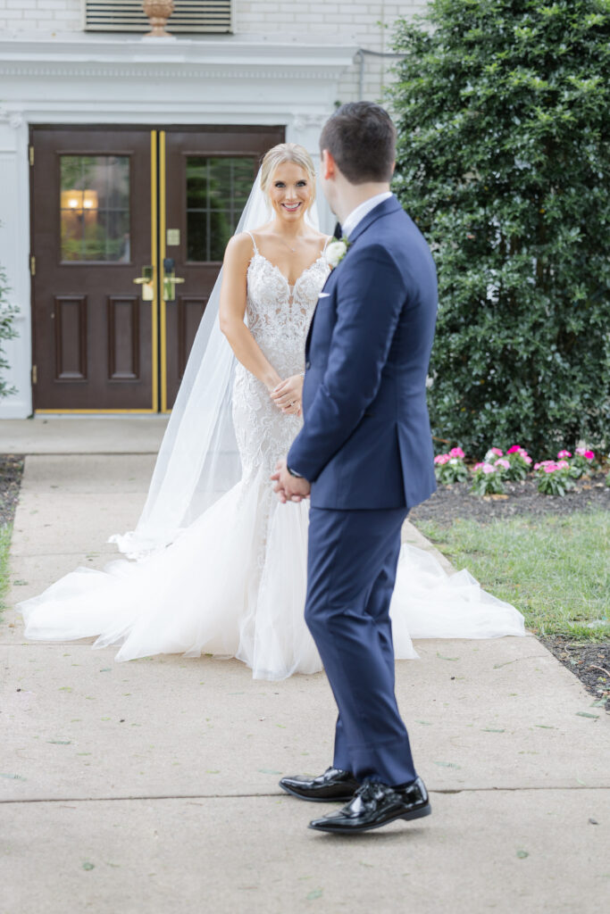 Bride and groom first look outside Madison Hotel Venue