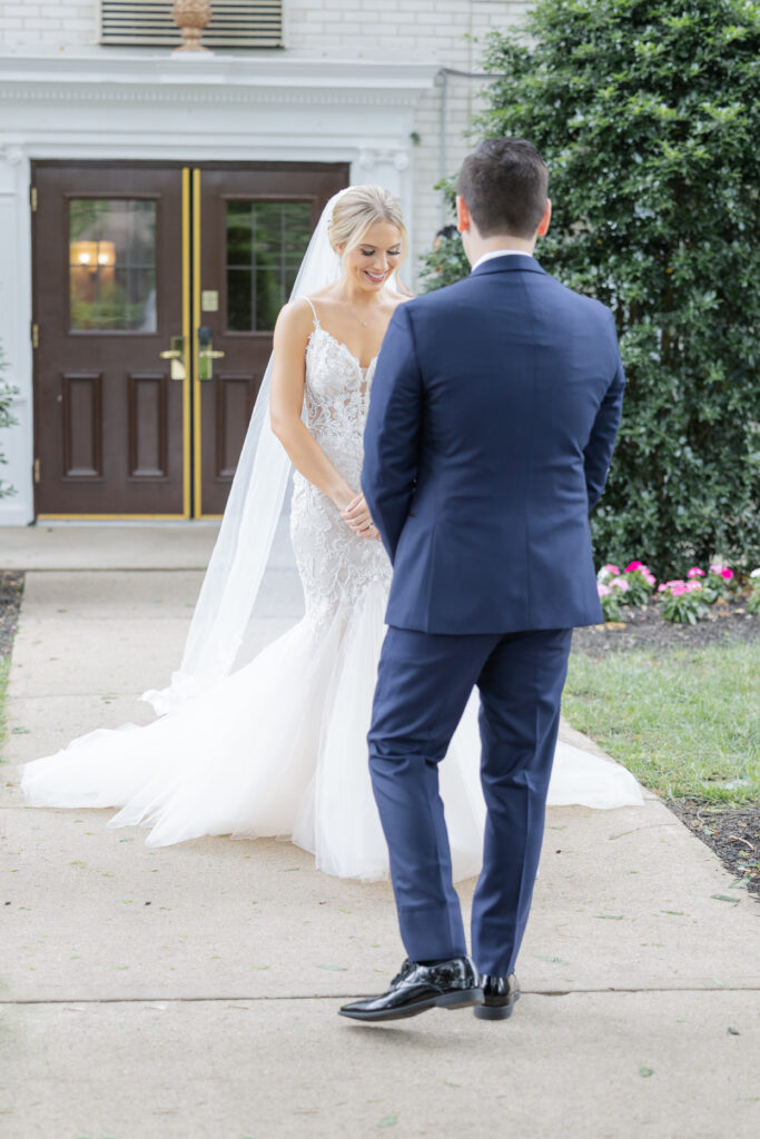 Bride and groom first look outside Madison Hotel Venue