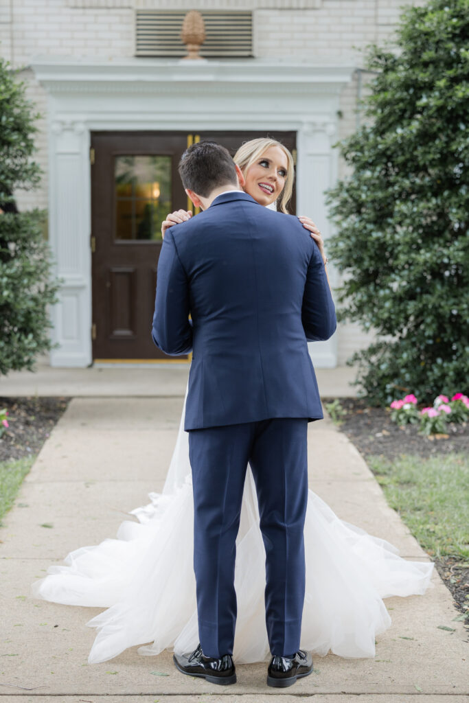 Bride and groom outdoor intimate moment after first look at Madison Hotel