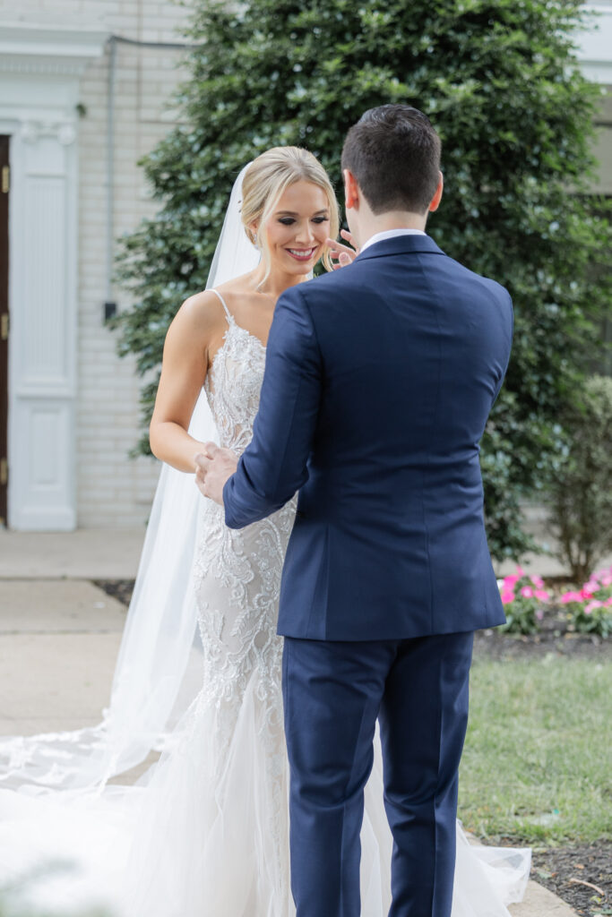 Bride and groom outdoor intimate moment after first look at Madison Hotel