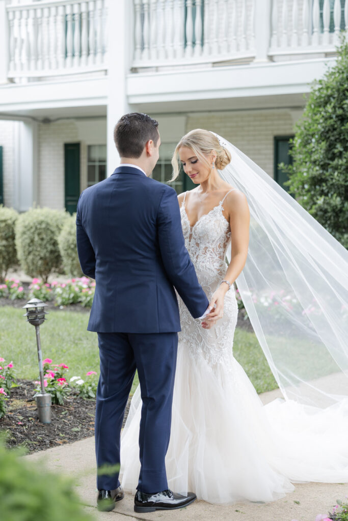 Bride and groom outdoor intimate moment after first look at Madison Hotel