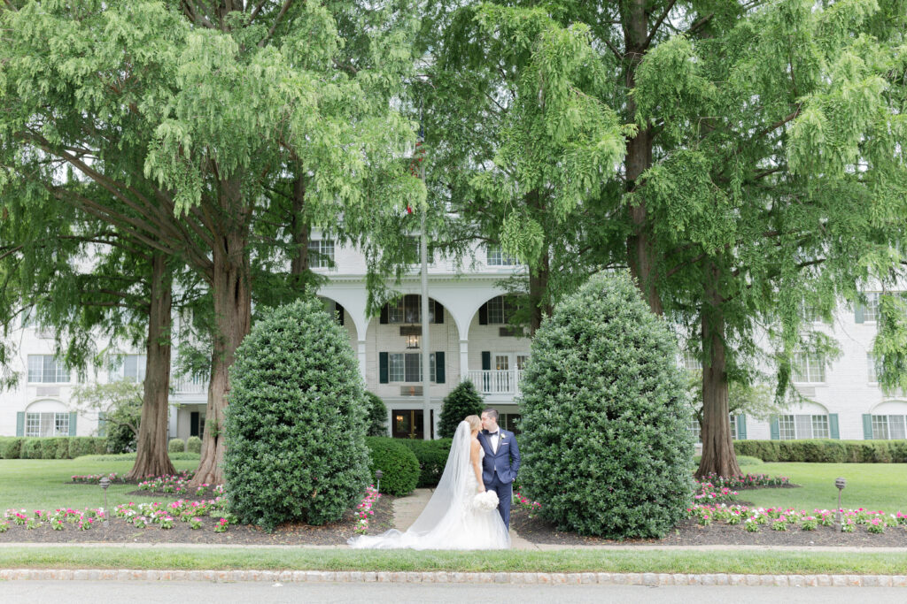 Bride and groom in front of Madison Hotel, NJ