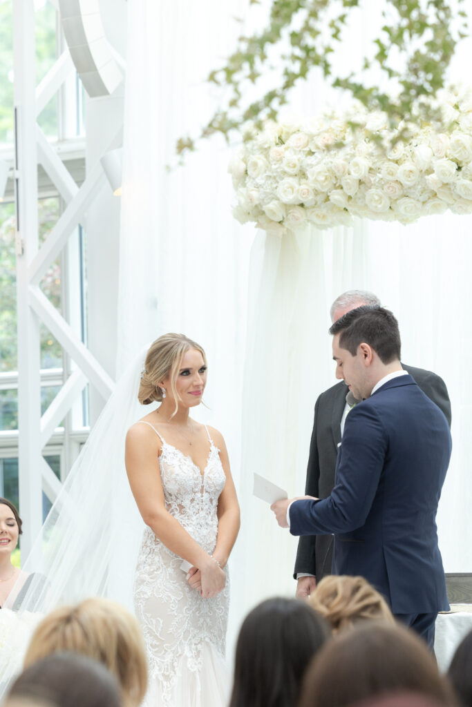 Groom reading vows at wedding ceremony inside NJ Wedding venue