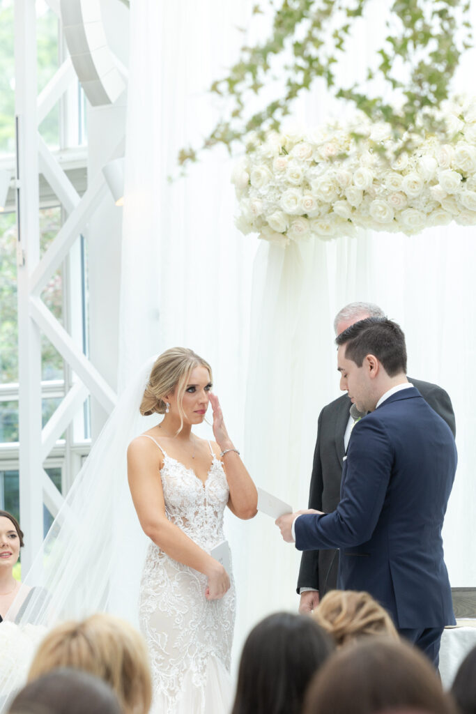 Groom reading vows at wedding ceremony inside NJ Wedding venue