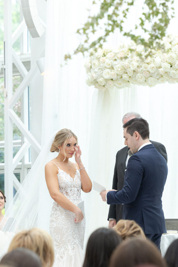 Groom reading vows at wedding ceremony inside NJ Wedding venue