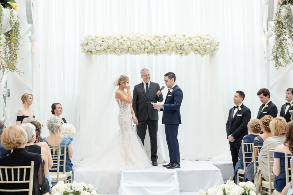 Groom reading vows at wedding ceremony inside NJ Wedding venue